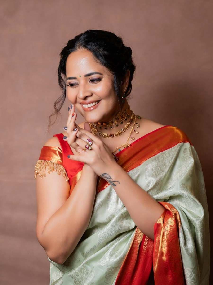 Anasuya looks beautiful in a traditional saree